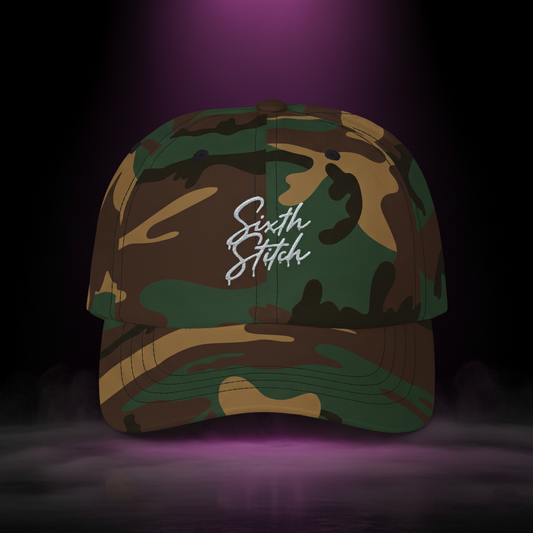 Sixth Stitch Drip Script Cap in camouflage — streetwear dad hat with embroidered “Sixth Stitch” logo, premium cotton fit, urban camo design, part of the Quantum Stitch streetwear collection.