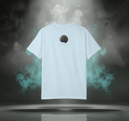 Back view of the Sixth Stitch Neural Stitch Tee in chambray blue featuring the signature “Big Brain” graphic and text “Beyond Reality. Into Style.” centered between vertical Sixth Stitch lettering.