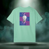 Sixth Stitch Abstract Notion Tee in island-reef green. Back print shows a glowing white lightbulb centered over purple-blue abstract grid with repeating “sixth.stitch” text.