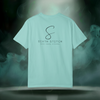 Back view of the First Impression Tee in chalky mint blue showing the large “S” script logo above the text “SIXTH STITCH – NEXT LEVEL APPAREL.”