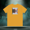 Back of Sixth Stitch Lucid Blur Tee in mustard yellow featuring surreal “Lucid Blur” city reflection graphic with neon hues, blurred lighting, and mirrored Sixth Stitch text.